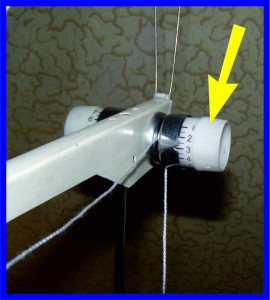 Пружина нитевода в вертикальной системе натяжения нити